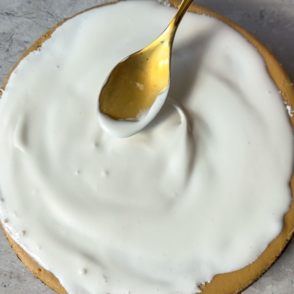 Once the cake has been baked & chilled, add whipped cream & salted caramel drizzle.