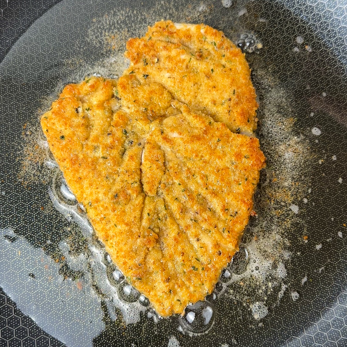 Fry the chicken schnitzel.