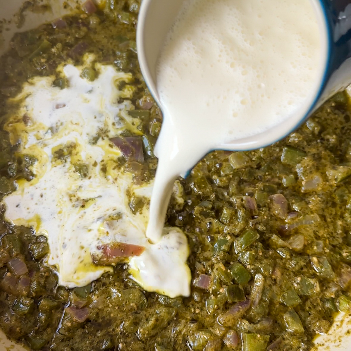 Add in pesto, pasta water & heavy cream.