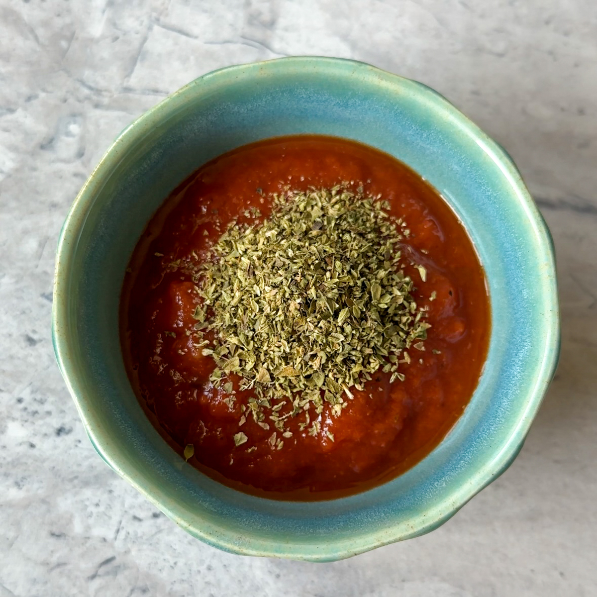 Combine ketchup, tomato sauce & oregano.