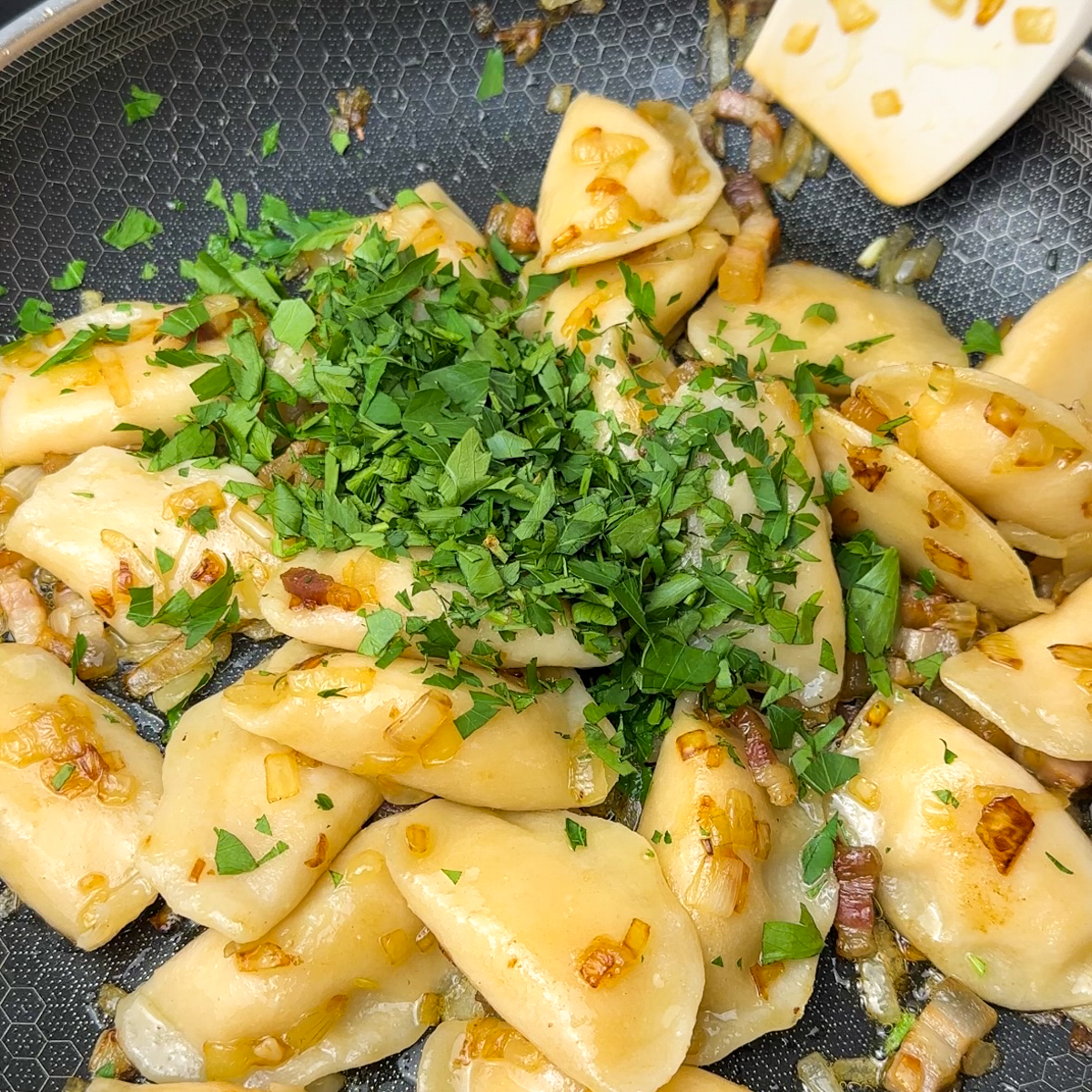 Add in perogies & parsley, mix it all together!