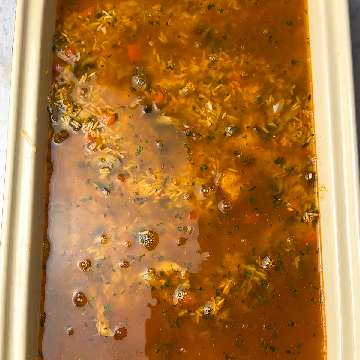 Add the rice & seasoned water, bake for 50 minutes covered & then 25 minutes uncovered!