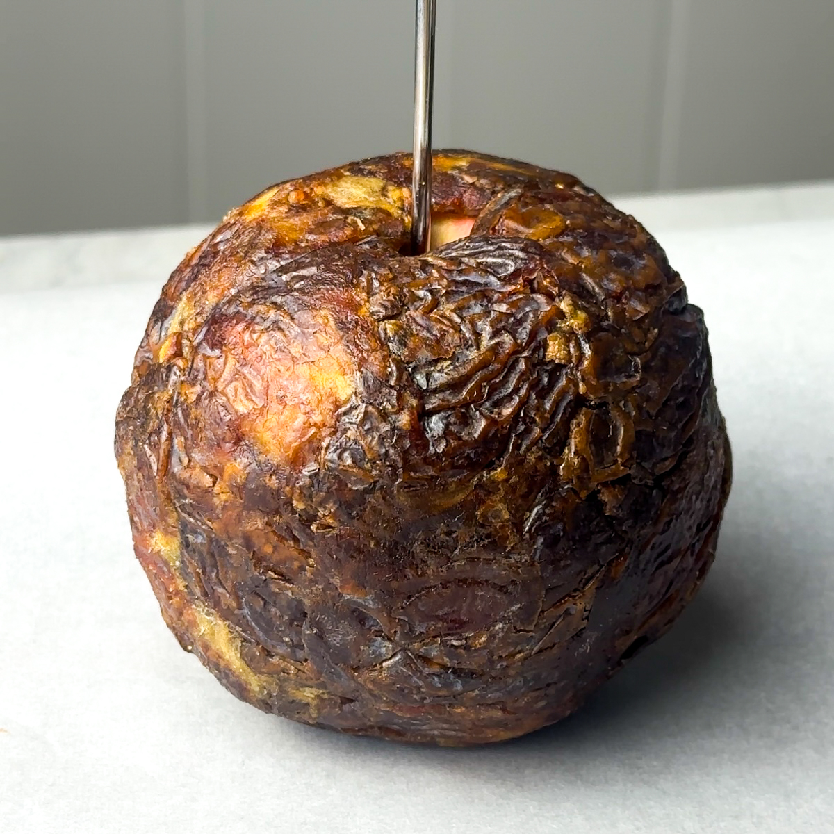 Wrap the apple in the dates, using the plastic wrap!