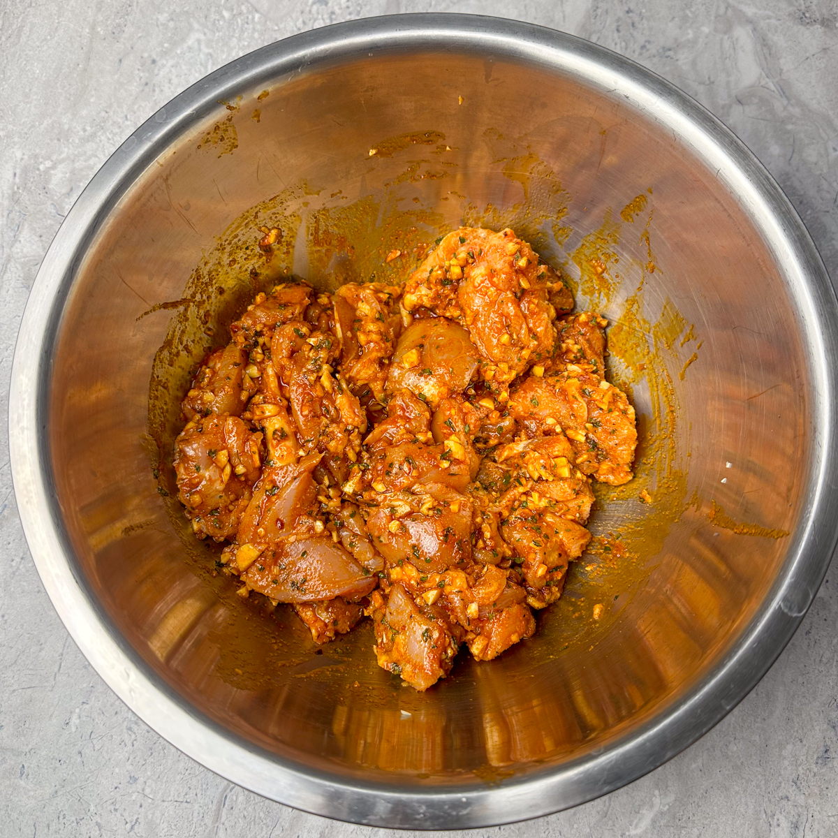 Marinate the cubed chicken thighs