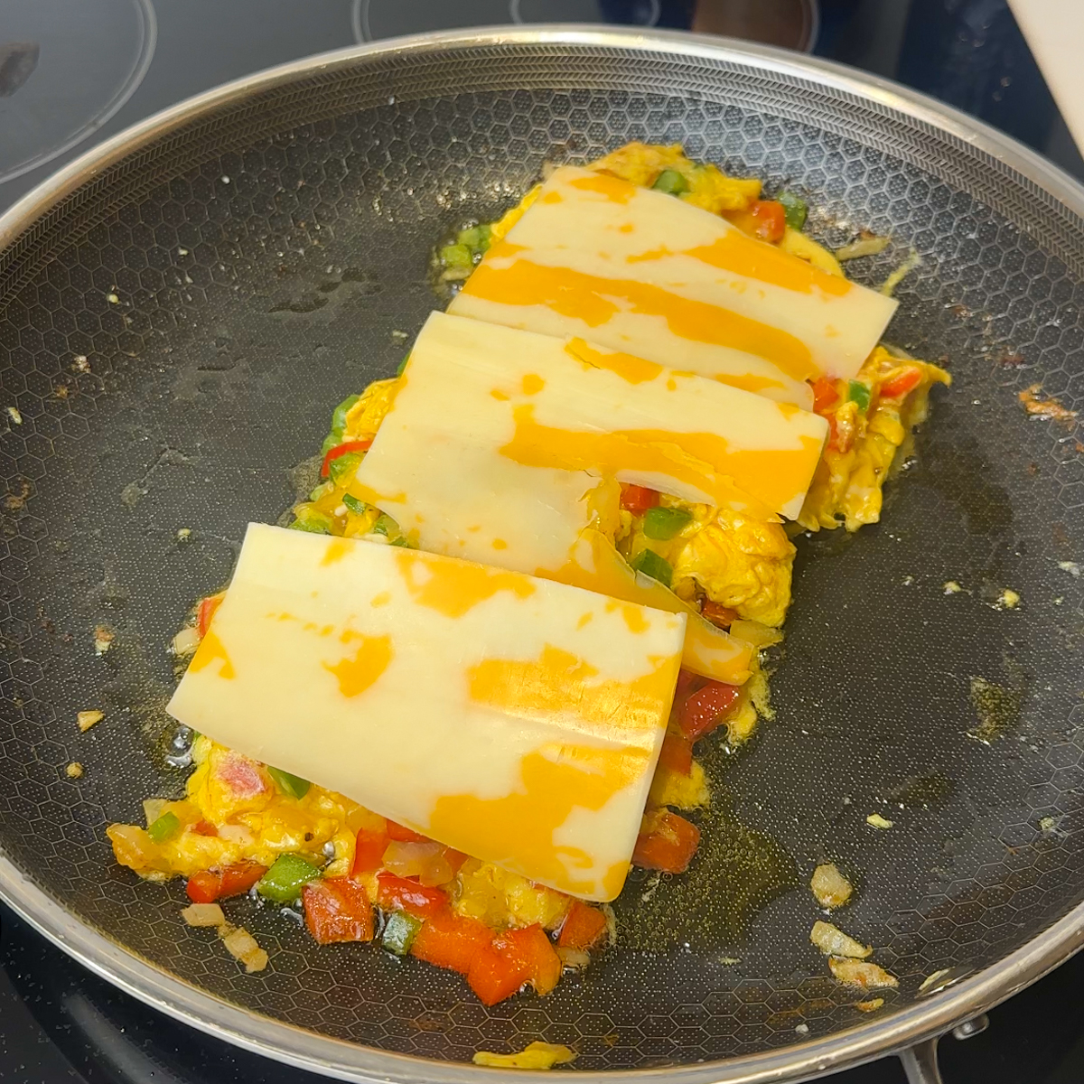 In the same pan make the eggs & add cheese overtop to melt!