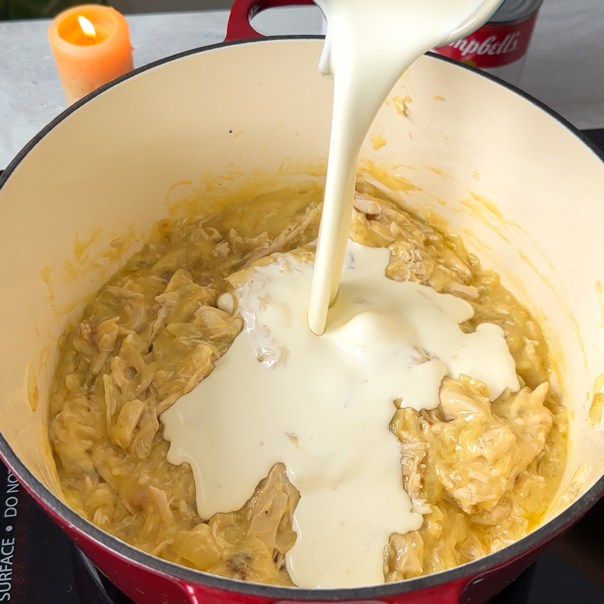 Pour in the heavy cream, water, pasta & sun dried tomatoes!