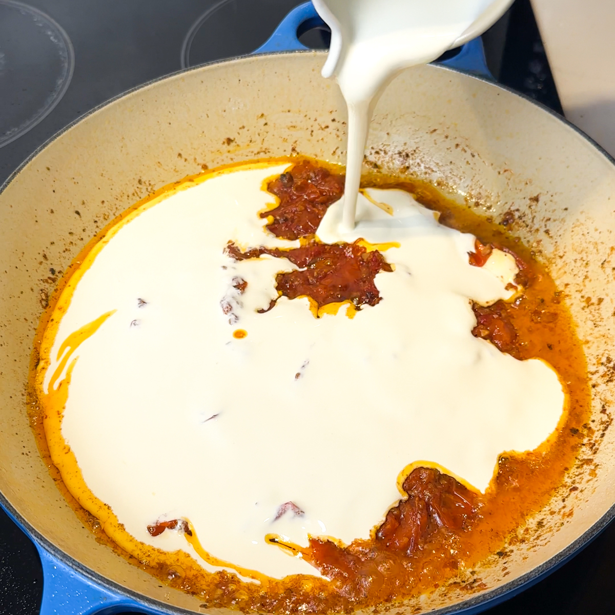 Sauté the minced garlic, cherry tomatoes & add in the tomato paste & heavy cream!