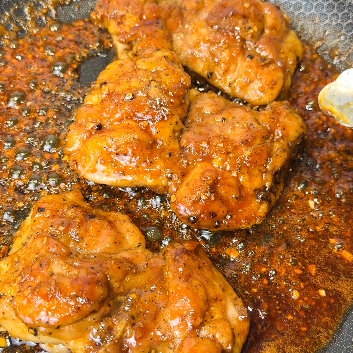 Add the sauce to the pan & coat the chicken!