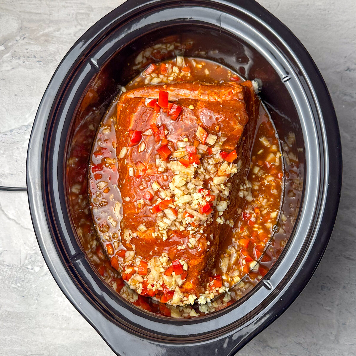 Add it to a slow cooker with all the veggies & the bbq liquid mixture!