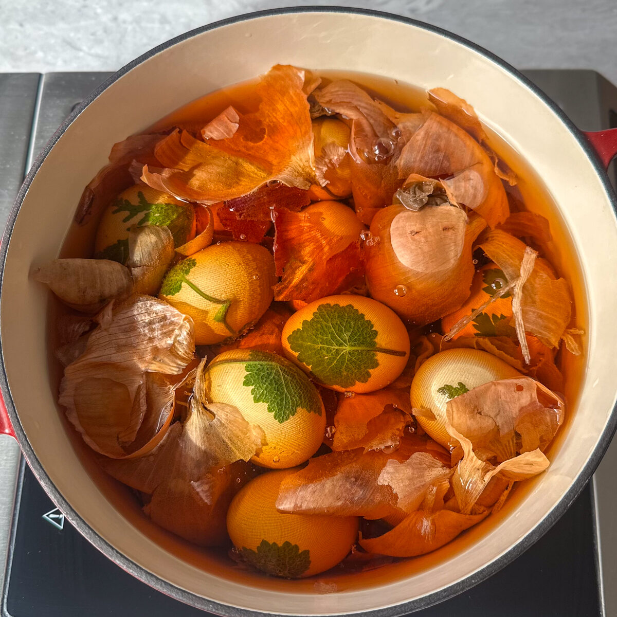 Arrange all the eggs in a pot with the onion skins, salt, water & vinegar until fully submerged