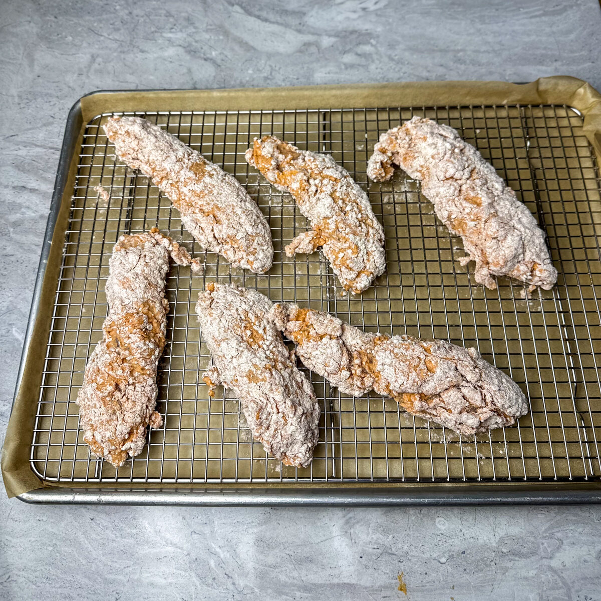 Dip the chicken tenders in the dry mixture.