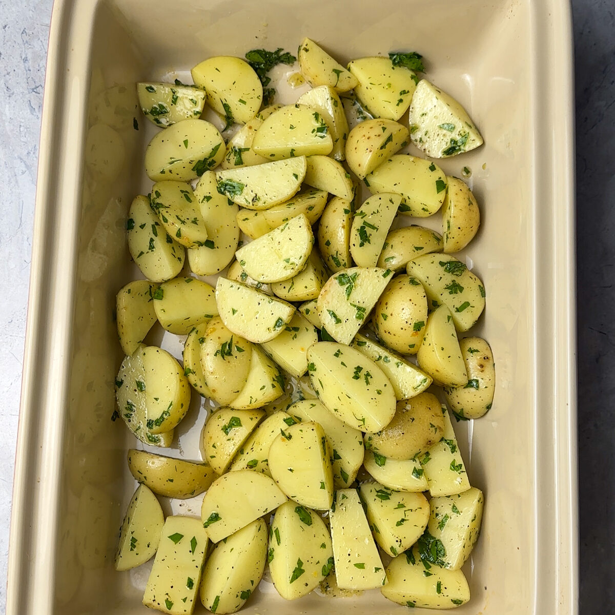 Start layering the potatoes, cauliflower, chicken & béchamel (video below)