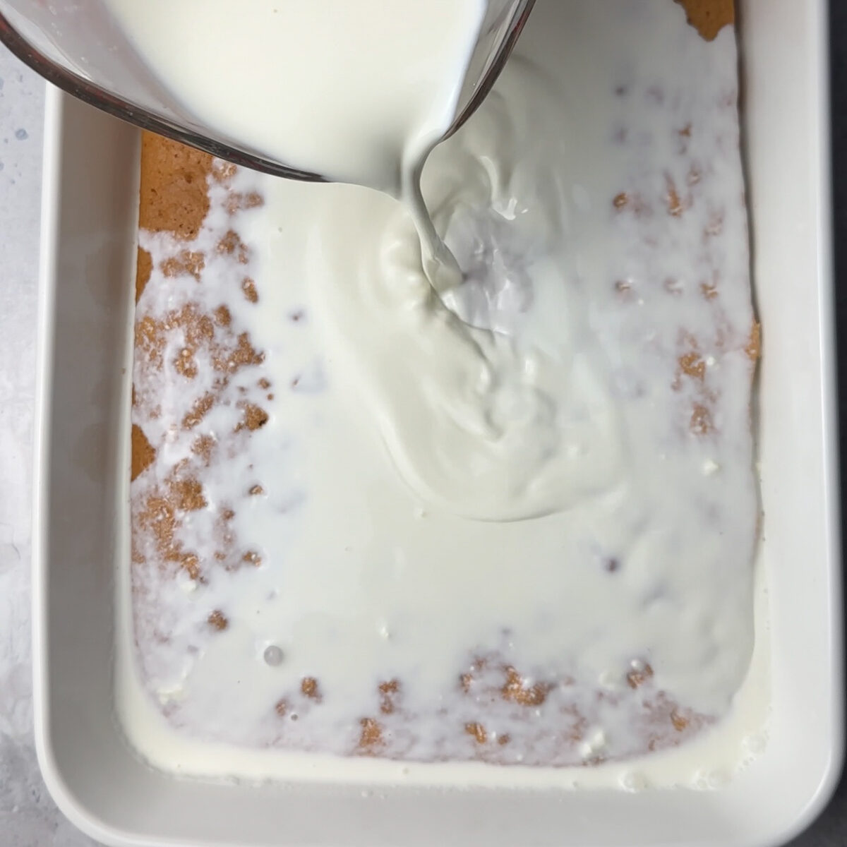 Transfer to a baking dish & bake, once cooled add the milk!