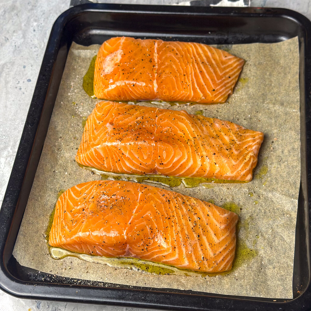 Salt & pepper the fresh salmon fillets & brush them with olive oil!