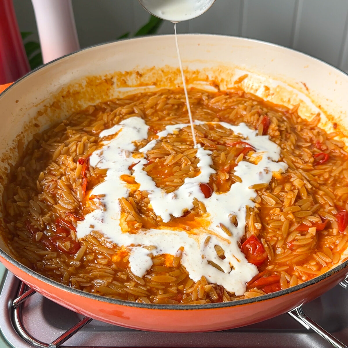 Pour in the broth & the heavy cream...