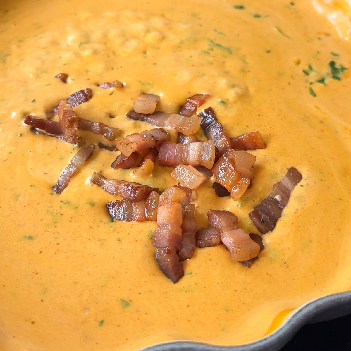 Add the bacon back in along with our cheeses!