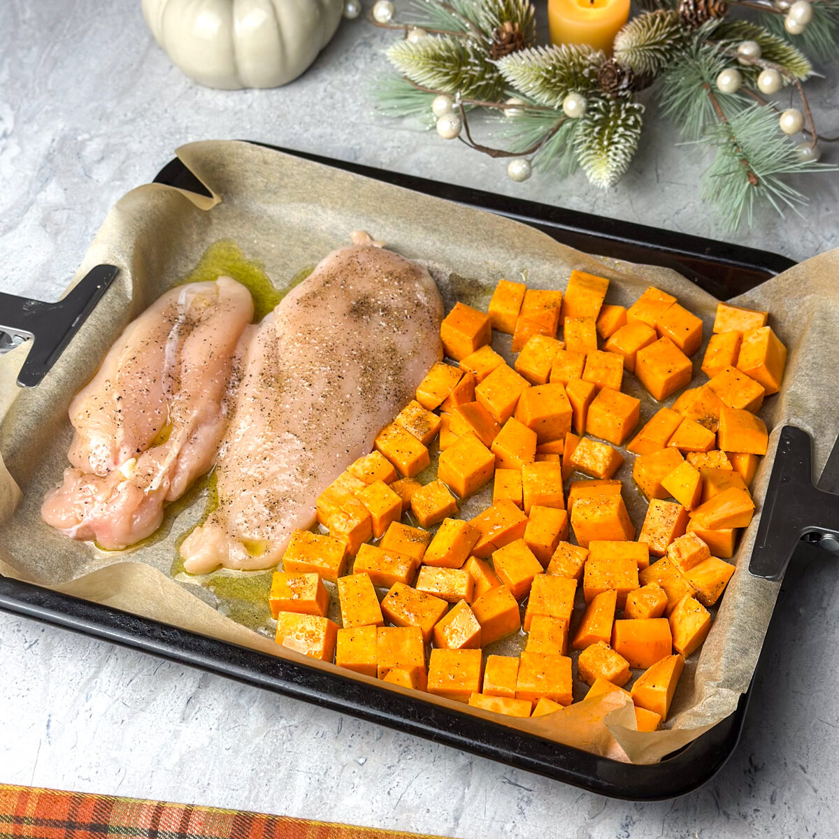 Add salt, pepper & olive oil to the chicken & cubed sweet potato!