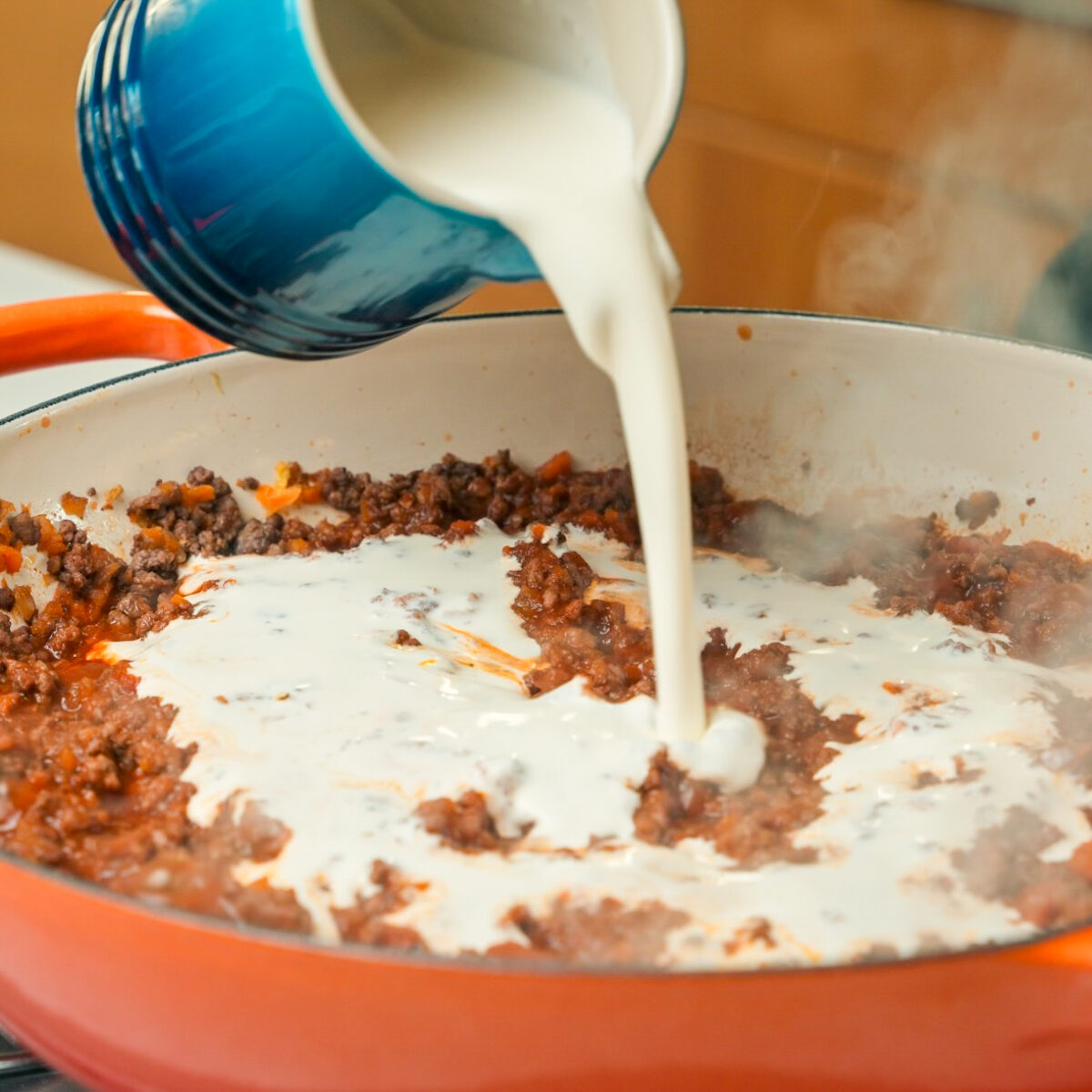 Add tomato paste, red wine, tomato sauce & heavy cream!