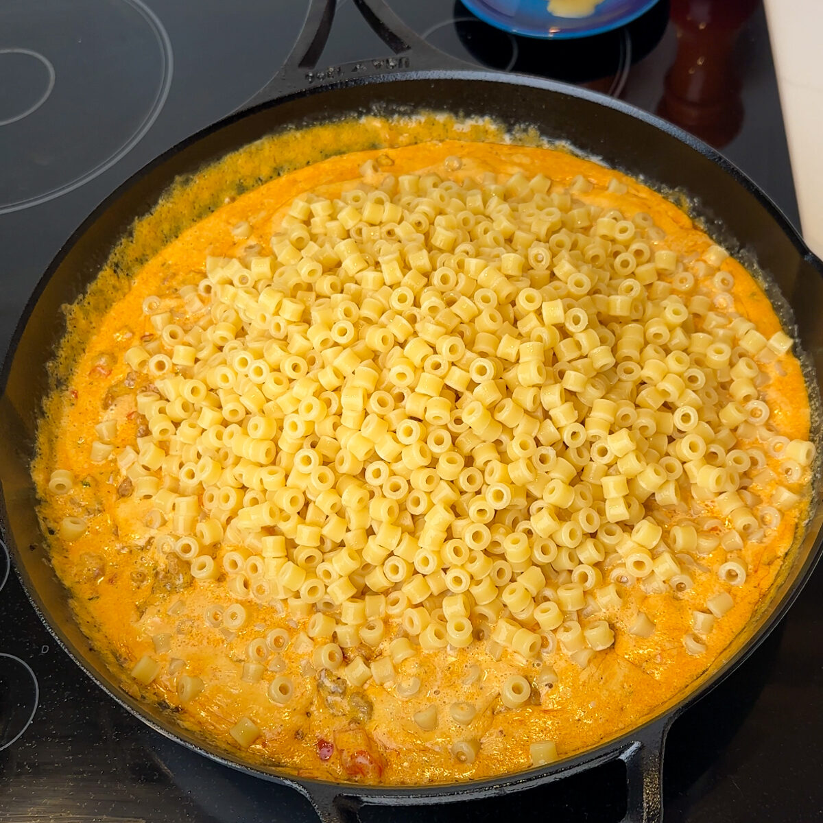 Once the sauce is done, add in the al dente ditali pasta & let it all thicken together!