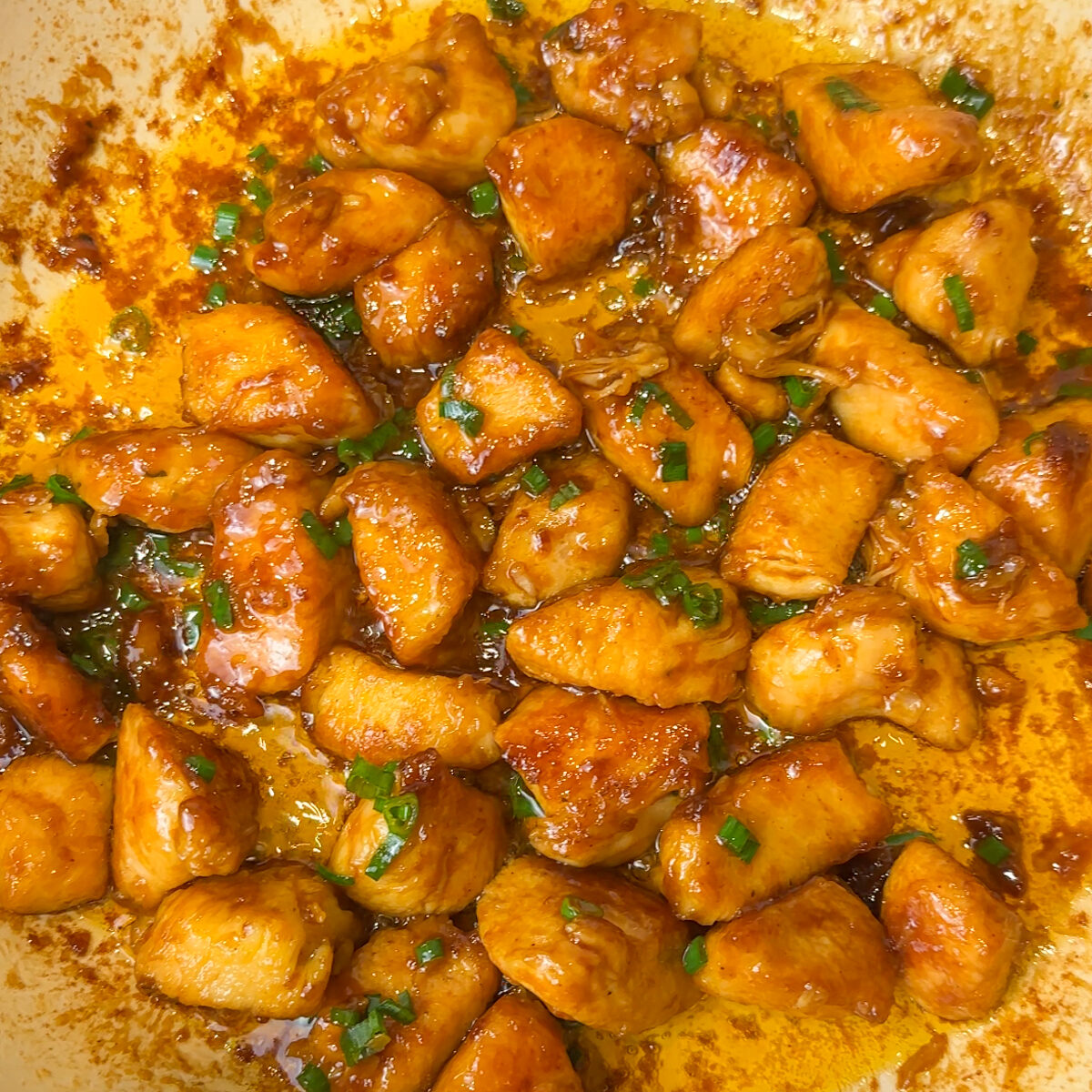 Let the sauce thicken & add in the green onions off heat & mix!