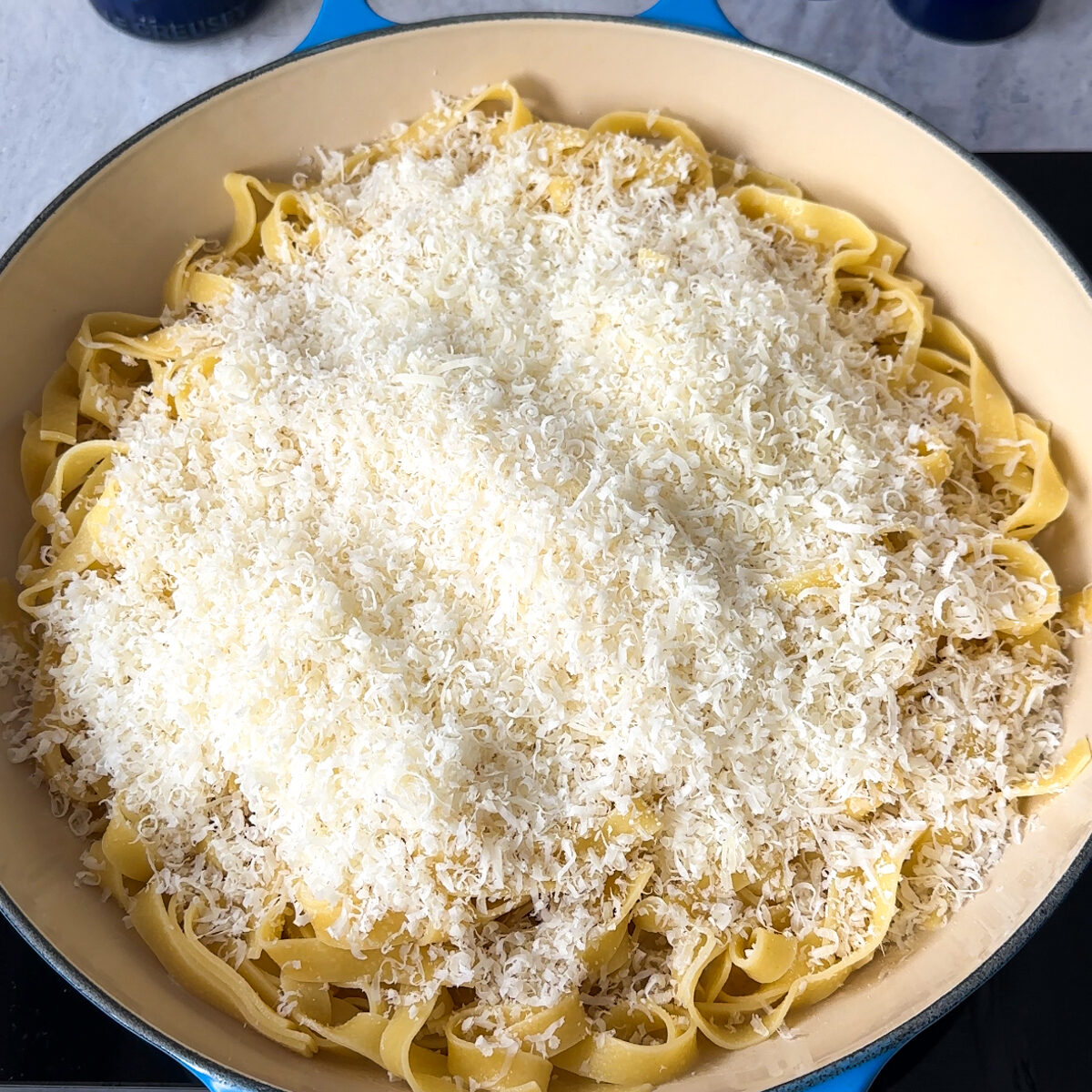 Add in the al dente pasta & the parmesan off heat & mix!