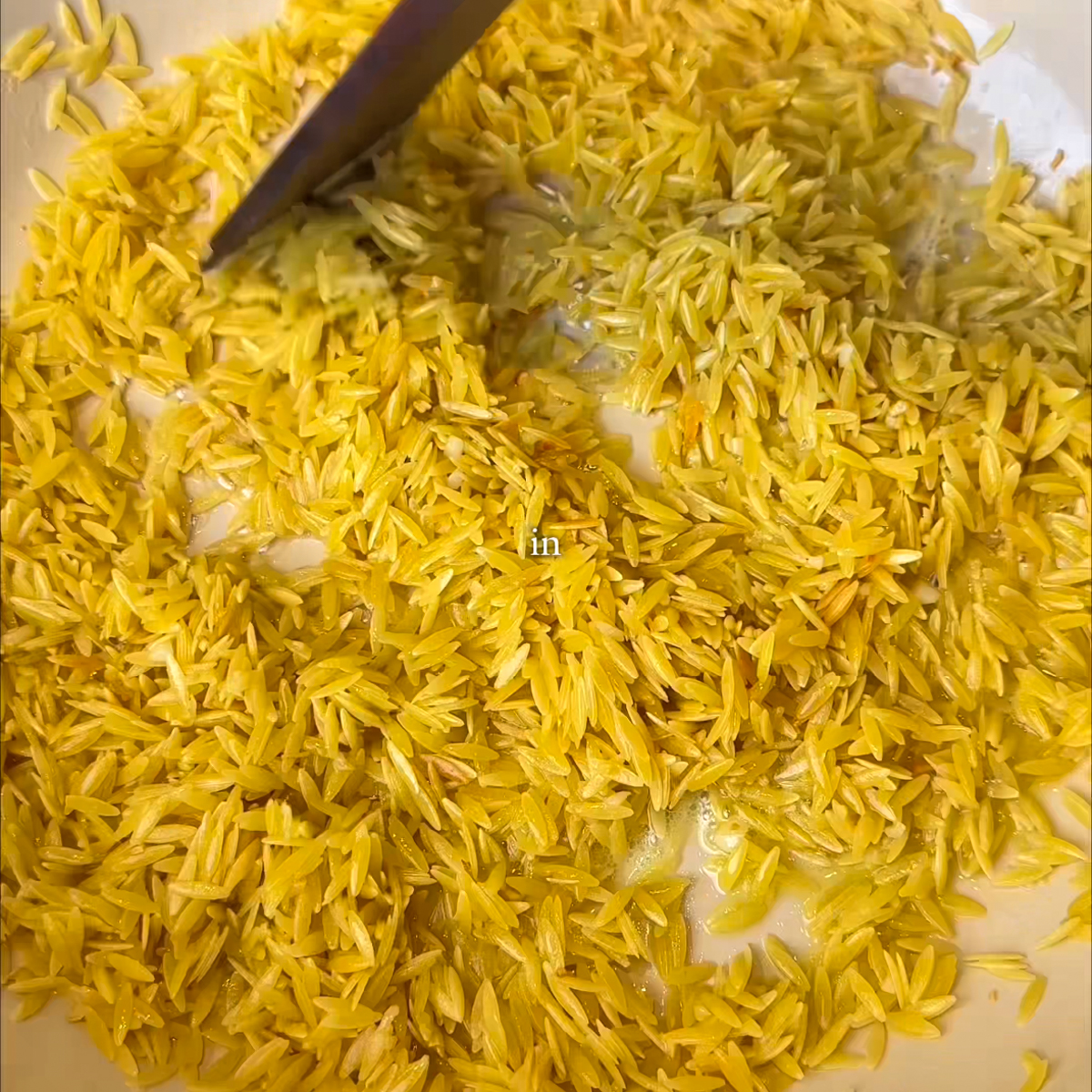 Toast the garlic in butter and add the orzo!