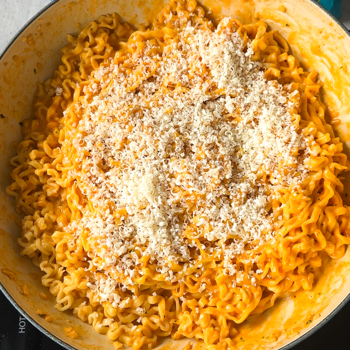 Add the ramen & the freshly grated cheese!