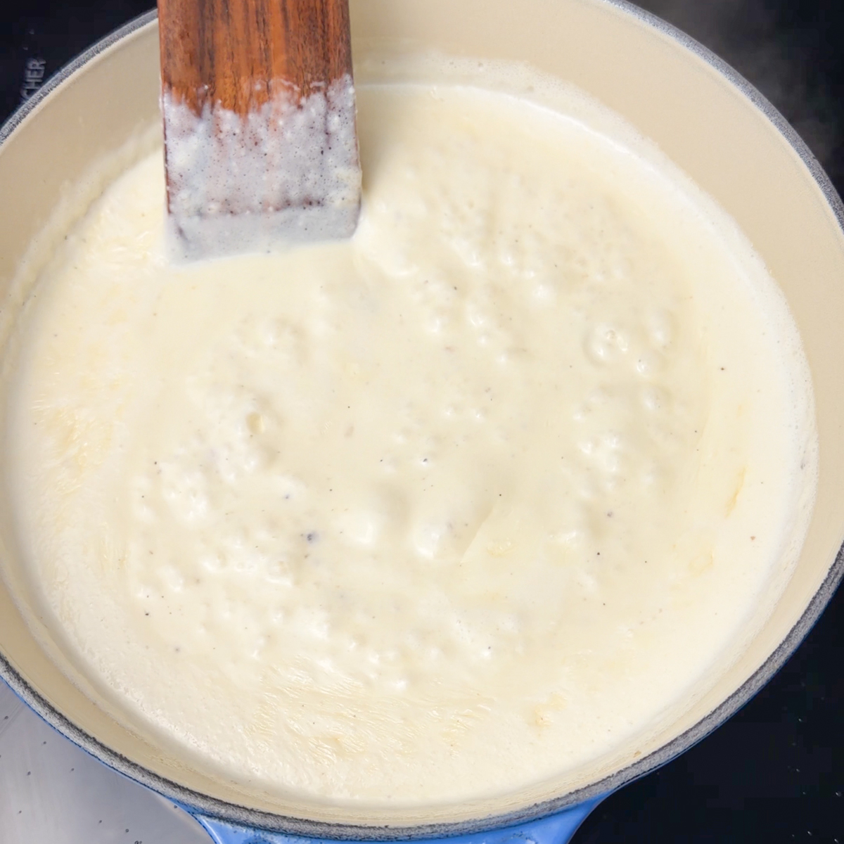 Melt the butter, add in the heavy cream, spices & let it thicken to make the béchamel!