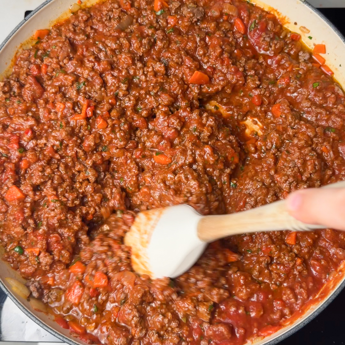 Sauté all our diced veggies & add in the beef, tomato sauce & all the spices for the bolognese sauce!