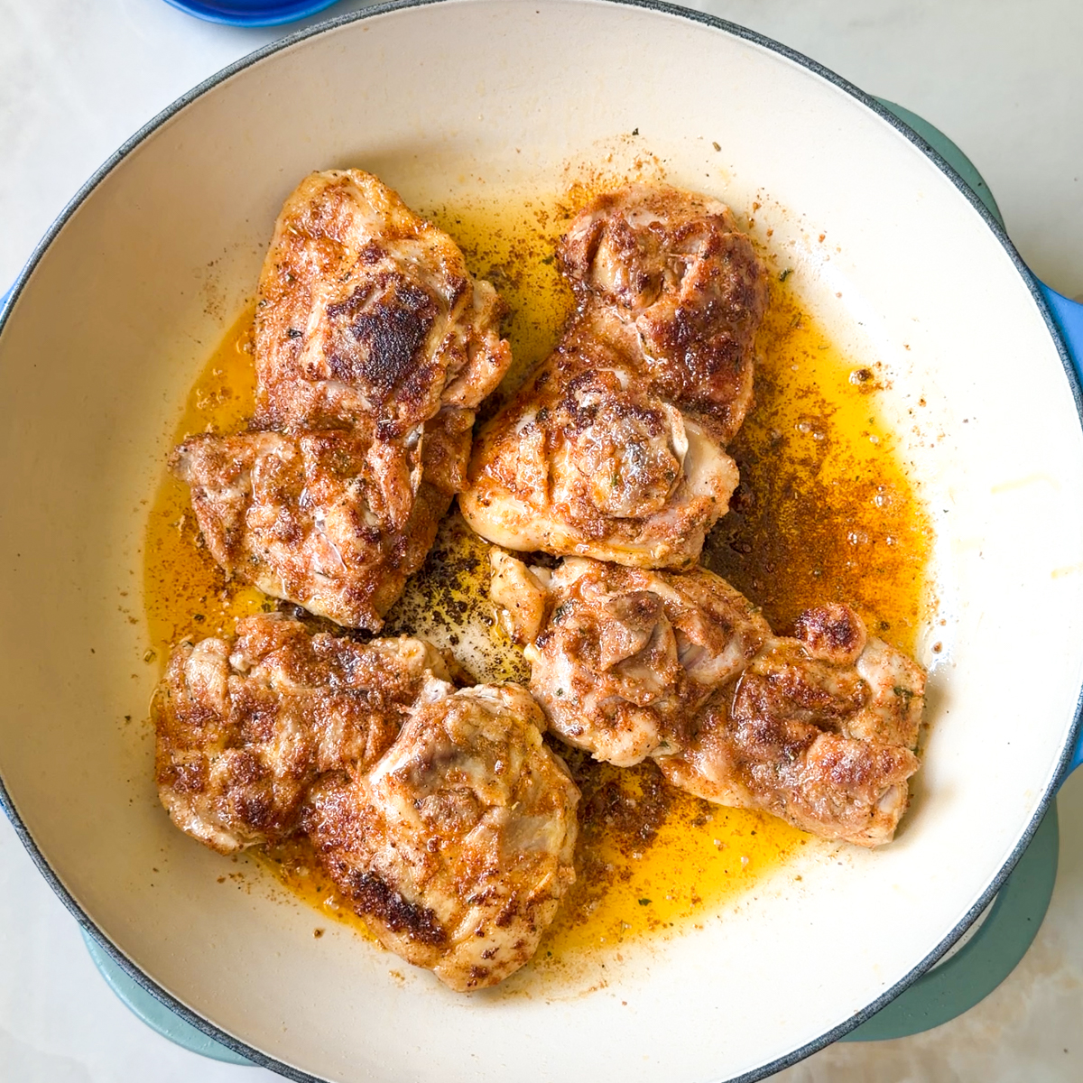 Sear the chicken thighs on both sides until fully cooked through!