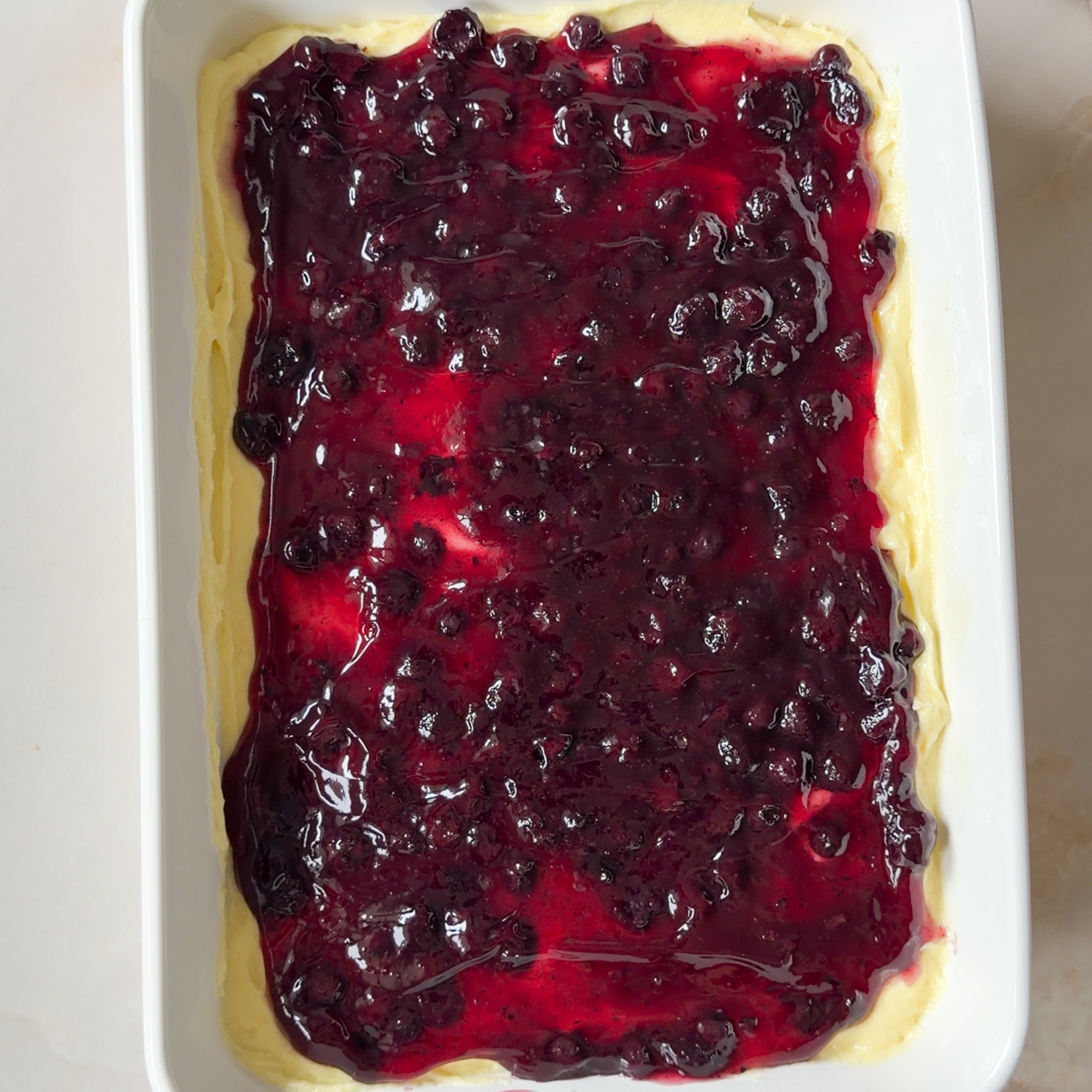 Add the store-bought blueberry pie filling & the whipped cream on top!