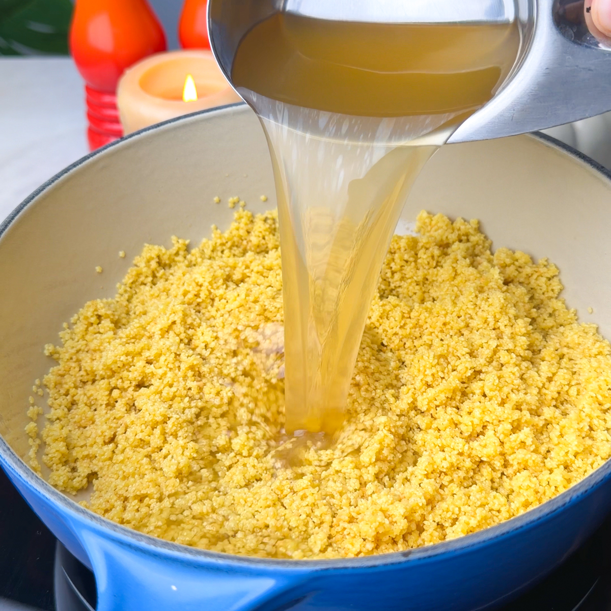 Add in the chicken broth, along with butter & pecorino Romano!