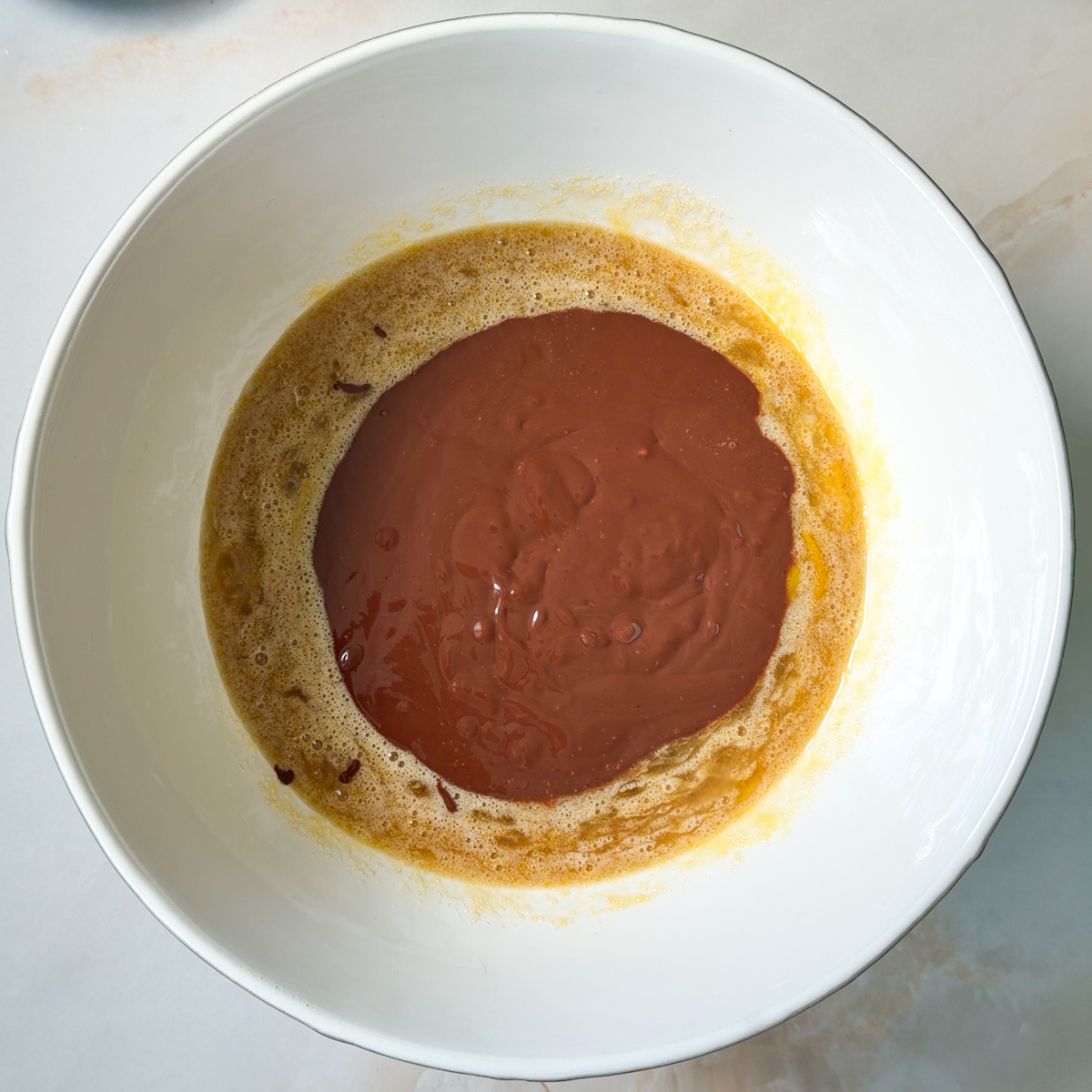Mix together the wet ingredients & add in the chocolate butter mixture!