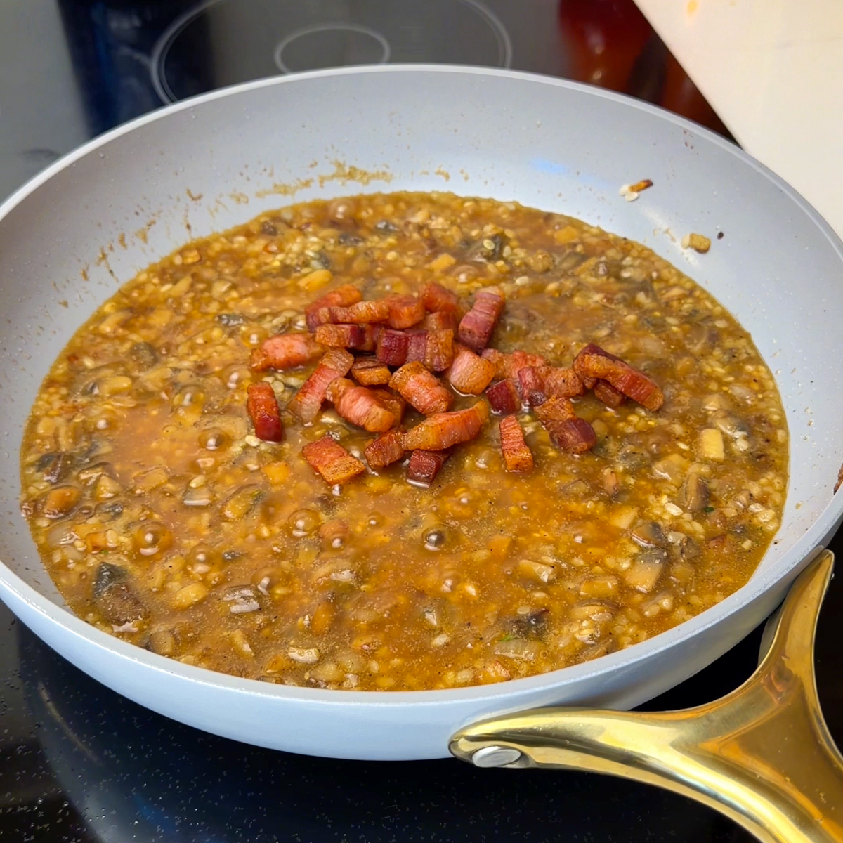 Add the bacon in & more chicken broth, cook until it's al dente!