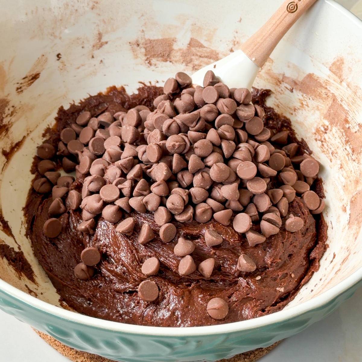 Second, sift in the dry ingredients until a brownie dough forms & add in the chocolate chips!