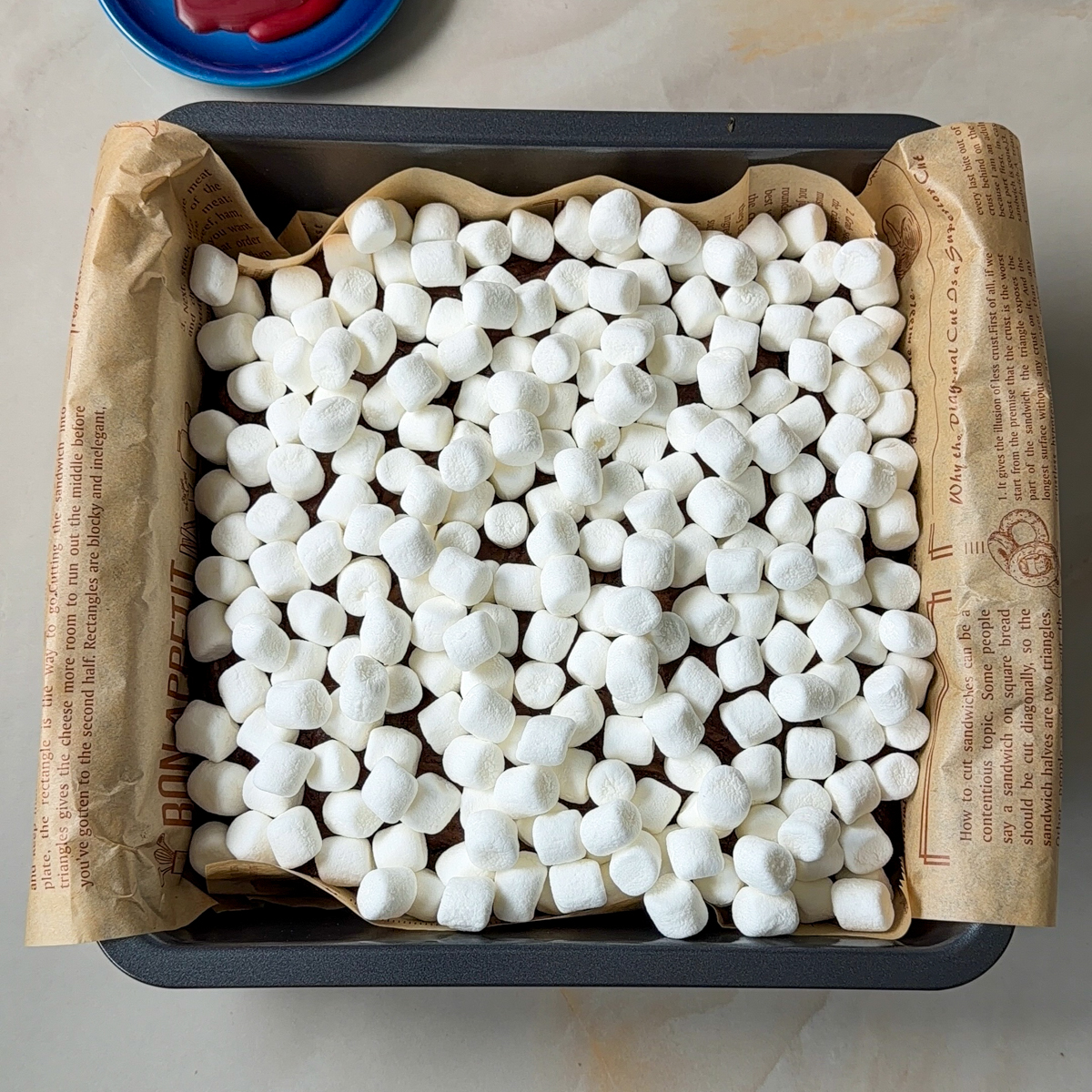Transfer to a baking dish with graham cracker crumbs at the base & bake! Top with marshmallows!