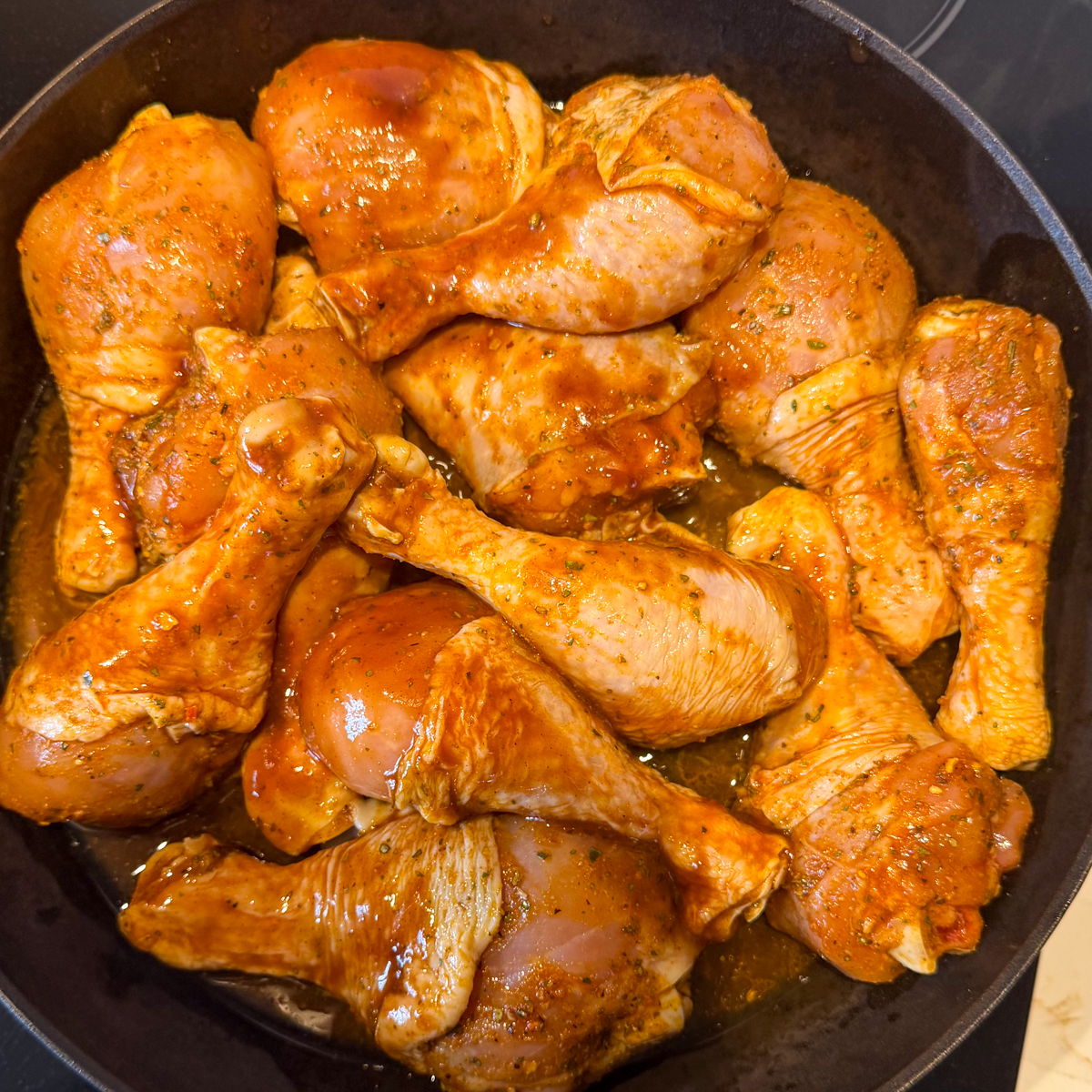 Coat the chicken drumsticks in the marinade!