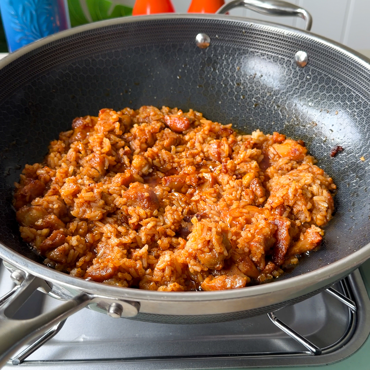 Next, add in the day old rice with the soy sauce & all our seasonings!