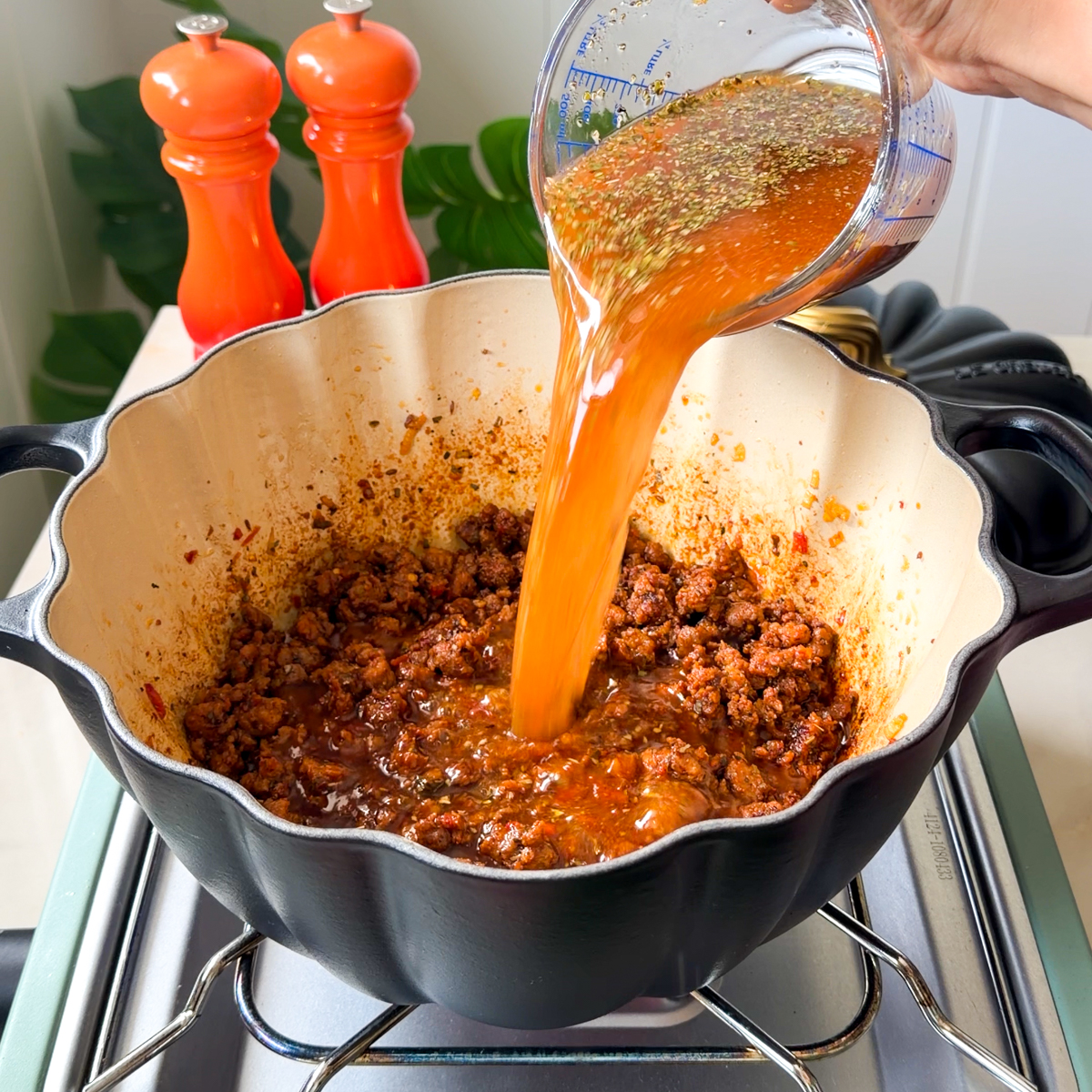 Add in the butter, tomato paste, seasonings, broth, heavy cream, gnocchi & spinach!